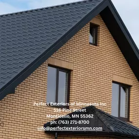 Modern residential home featuring a sleek black metal roof and energy-efficient windows.