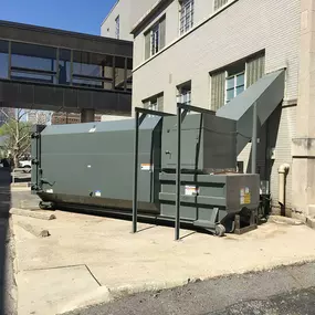 Custom thru-the-wall self-contained chute with compactor