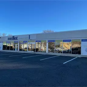 Wide shot of our large medical equipment showroom entrance in Elmwood Park, showcasing free parking and a visible storefront for walk-in visitors.