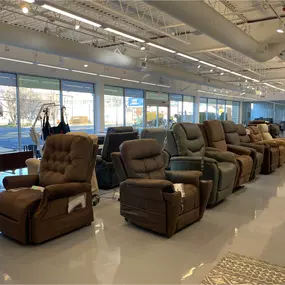 Reclining lift chairs lined up inside our Elmwood Park showroom — available in multiple styles and brands for comfort, mobility, and in-home recovery.