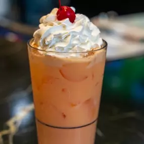 A frozen drink with whipped cream at Reel Food & Drink