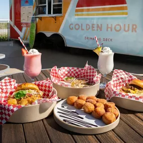 The Golden Hour Pool Bar with a display of food and drinks
