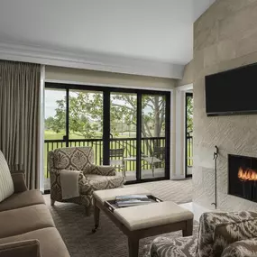 Enjoy the comforts of home in a Classic Mansion Residences Suite with a full kitchen, dining area, spacious living room with fireplace, and private patio.