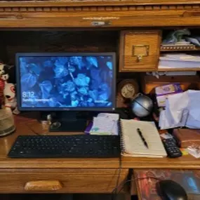 A photo of the desk I work at in my home. I am a one-woman business.