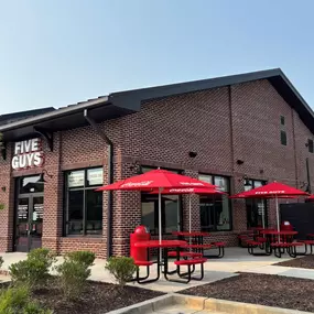 Exterior photograph of the Five Guys restaurant at 6135 Ollie Walk in Alpharetta, Georgia.