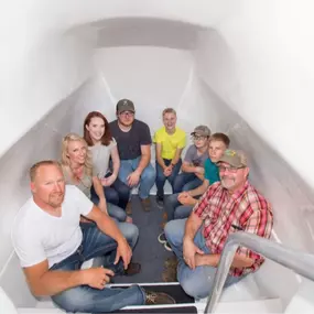 Reinforced concrete tornado shelter installed in North Texas. Built for durability with weather-sealed steel door and 10-year structural warranty.