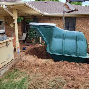 Flush-mount underground garage storm shelter in Sherman, TX. Discreet design with easy-access lid and impact-tested components.