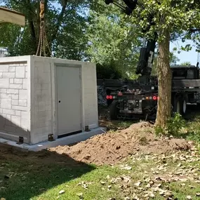 Above-ground steel safe room installed inside a Texas garage. Built to withstand tornado-force winds with 6-point locking system and ventilation.
