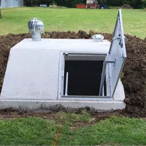 Close-up of storm shelter door certified by Texas Tech Wind Institute. Designed for extreme weather and reinforced locking.