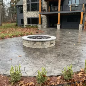 Decorative concrete patio with fire pit.