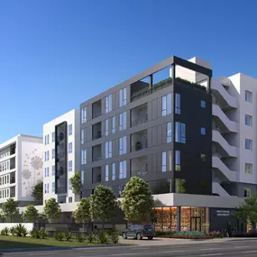 A white and grey building with 6 stories and a clear blue sky