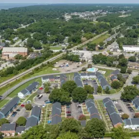 Aerial drone view of Hilton Village Townhomes showcasing the layout and surrounding greenery.