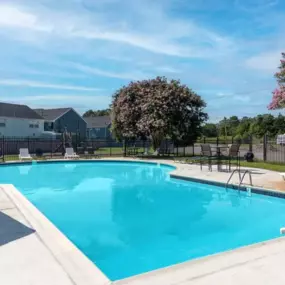 The pool area at Hilton Village Townhomes offers a refreshing space to relax and unwind.