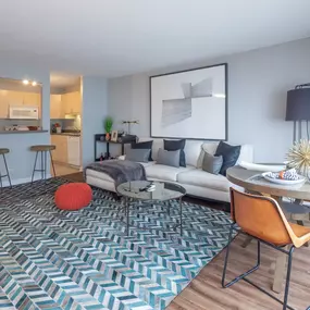 Furnished living room with open kitchen