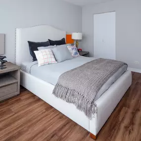 Furnished bedroom with large bed