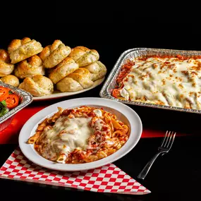 Baked ziti with garlic knots and fresh salad from Bambinelli’s Pizza & Pasta—perfect for pasta in Atlanta or catering from Italian restaurants in Atlanta. Cheesy, hearty, and ideal for anyone searching pasta near me.
