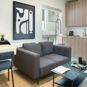 a living room with a gray couch and a coffee table