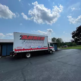 R.A. Ahner Furniture & Appliances delivery truck parked outside the store, ready to serve local customers with fast and reliable service.