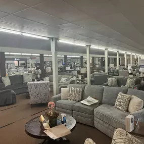Extensive showroom view featuring sectionals, recliners, and upholstered seating in a variety of configurations.