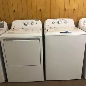 Classic GE washer and dryer set with easy-to-use dials and durable build—great for everyday household use.