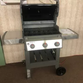 Weber Spirit II 3-burner grill featured in the showroom, ideal for outdoor cooking and summer entertaining.