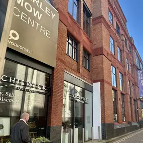 Street view of Barley Mow Passage with the Barley Mow Centre signage prominently displayed, showing the entrance to Chiswick Auctions—part of the building housing AECOR’s office.