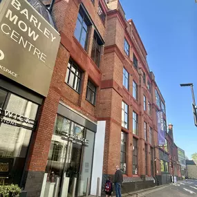 Exterior view of the Barley Mow Centre at 10 Barley Mow Passage, London, featuring the main signage above the entrance for Chiswick Auctions, part of the AECOR office location.