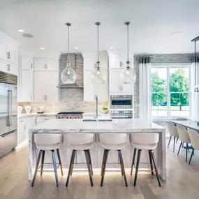 Gourmet kitchen with large center island and stainless steel appliances