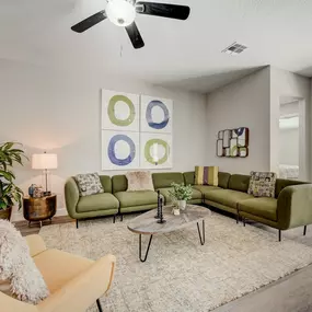 The spacious living room at The Groves at Lake Ella offers comfort, natural light, and modern style.