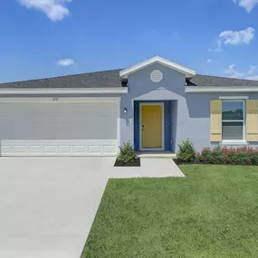 The exterior view of a home at The Groves at Lake Ella highlights classic charm and inviting curb appeal.