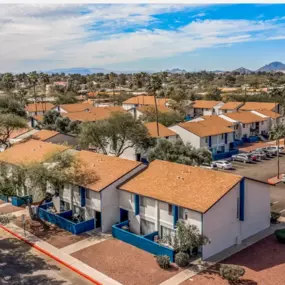 A top aerial view of Midtown at Seneca Apartments captures the entire community layout, including apartment homes, parking areas, and the surrounding neighborhood horizon.
