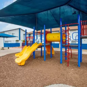 A vibrant playground at Midtown at Seneca Apartments where residents of all ages can play and socialize.