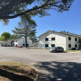 a parking lot with a car parked in front of a building