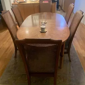 The image shows a Drexel Heritage Accolade II dining table with six chairs, set on a patterned rug in a room with other furniture.
