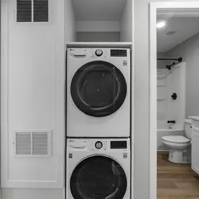 a small laundry room with a washing machine and a dryer