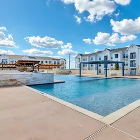 Resort-style swimming pool at Pyland Ranch Apartments in San Marcos, TX
