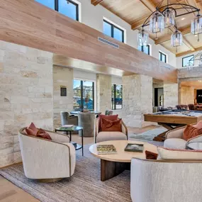 Stylish resident lounge with comfortable seating and modern decor at Pyland Ranch Apartments in San Marcos, TX
