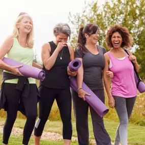 Group yoga scene captures community wellness events we host to encourage flexibility, bone density, and peer support.