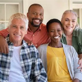 Three generations embrace, symbolizing how TMC’s evidence-based programs improve vitality for seniors, parents, and adult children across Atlanta, GA..
