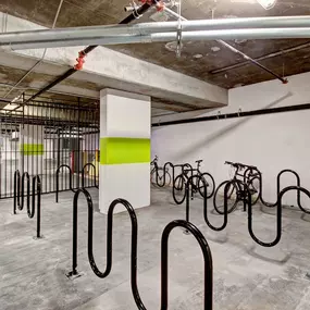 Secure bike parking and storage area at Harlow luxury apartments in Culver City, featuring ample space and gated access for residents' bicycles.