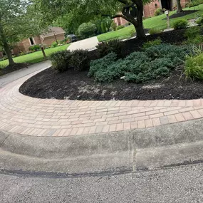 We landscaped this cul de sac island last year. It's in a neighborhood in Warren County. We really love the two-tier effect with the lover shrubs and the tree in the background. Are you looking to update your landscaping? Visit our website to see how we can help.