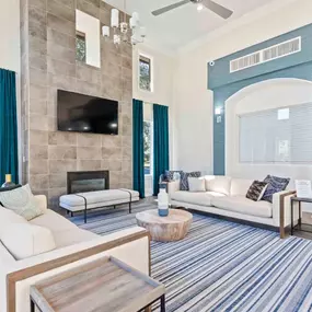 A living room with a fireplace and a flat screen TV