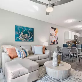 Living room with ceiling fan and wood style flooring