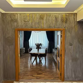 Step into a space that speaks of class — featuring high-end decorative wall textures, warm-toned wooden frames, and elegant ceiling layering. Perfect for clients seeking premium finishes with a rustic-modern blend.
