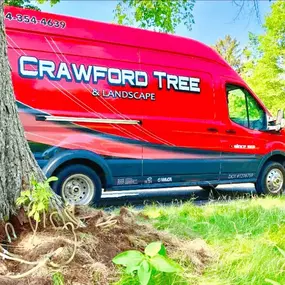Crawford Tree & Landscape’s branded service van at a client property.