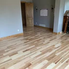 After photo: Light wood flooring upgrade adds warmth and natural beauty to this Colorado interior.