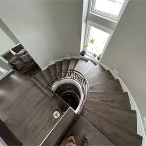 Grey flooring continues up the stairs with a seamless look, designed for durability in Colorado’s changing seasons.