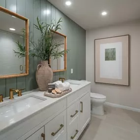 Well-appointed primary bathrooms with luxe finishes