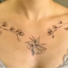 Fine line chest tattoo