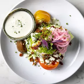 Wedge Salad with heirloom tomatoes, blue cheese, homemade dressing